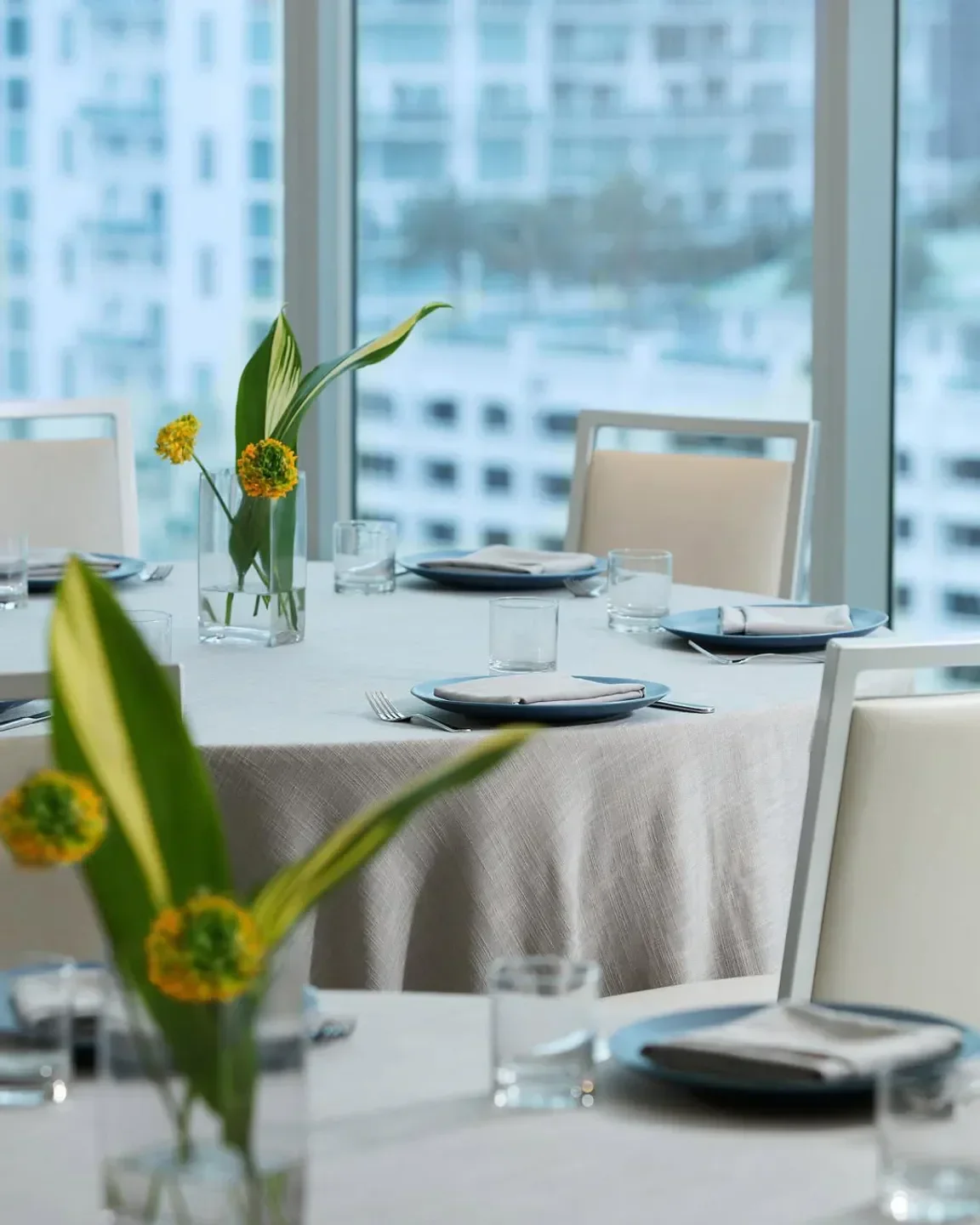Elegant table setting at Area 31 restaurant in Miami with a beautiful city view.