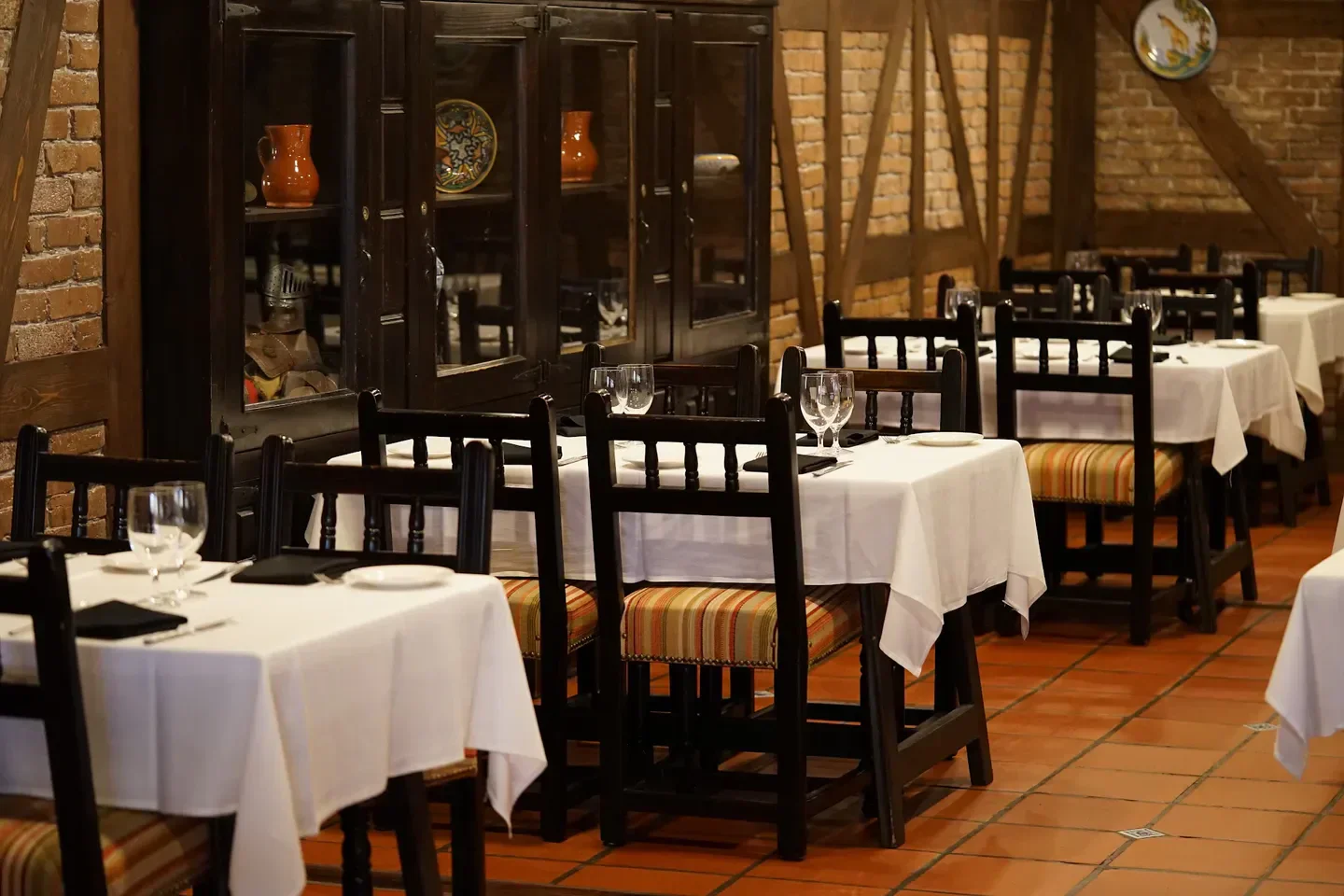 Casa Juancho in Miami, elegant dining room with tables set for guests.