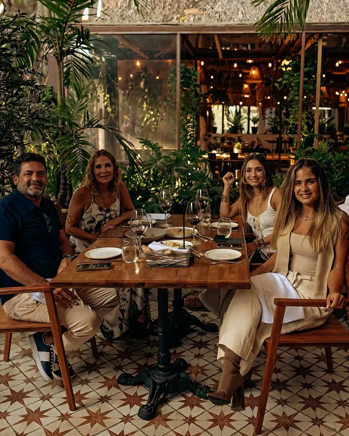 Group dining at Casa Vigil Miami restaurant in Miami, enjoying drinks and food