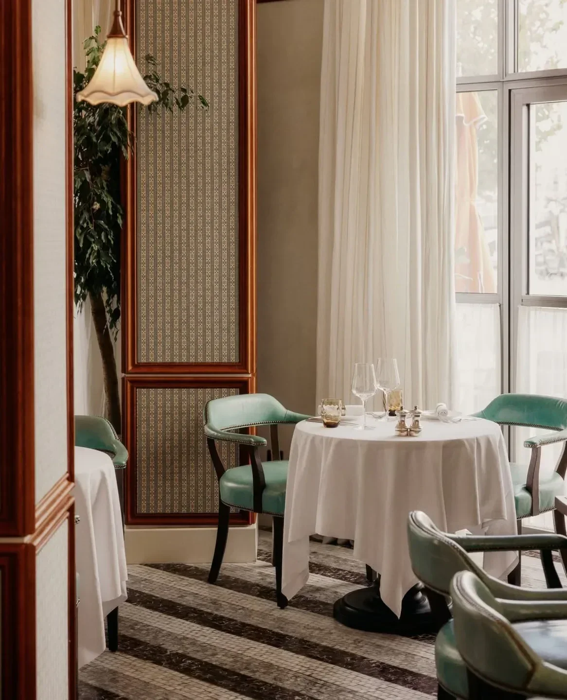 Elegant dining scene at Cecconi's Miami Beach, featuring stylish chairs and tables in Miami.