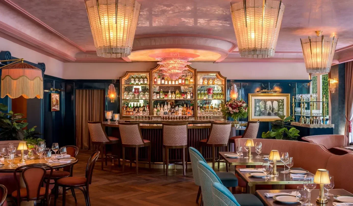 Interior of Contessa Miami restaurant with bar, tables, and stylish lighting.