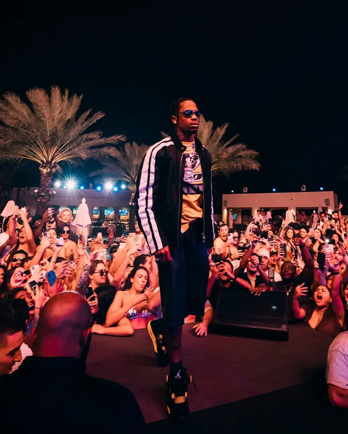 Concert scene at DAER Nightclub in Miami with artist performing in front of a crowd.