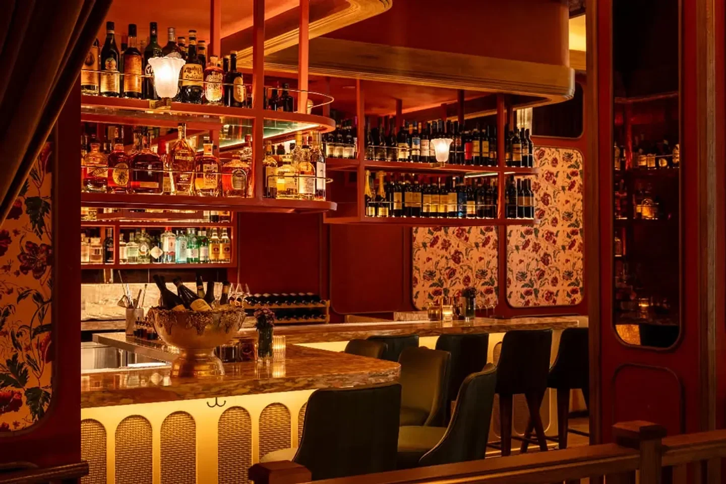 ERBA Miami restaurant's stylish bar with elegant decor, bottles and seating.