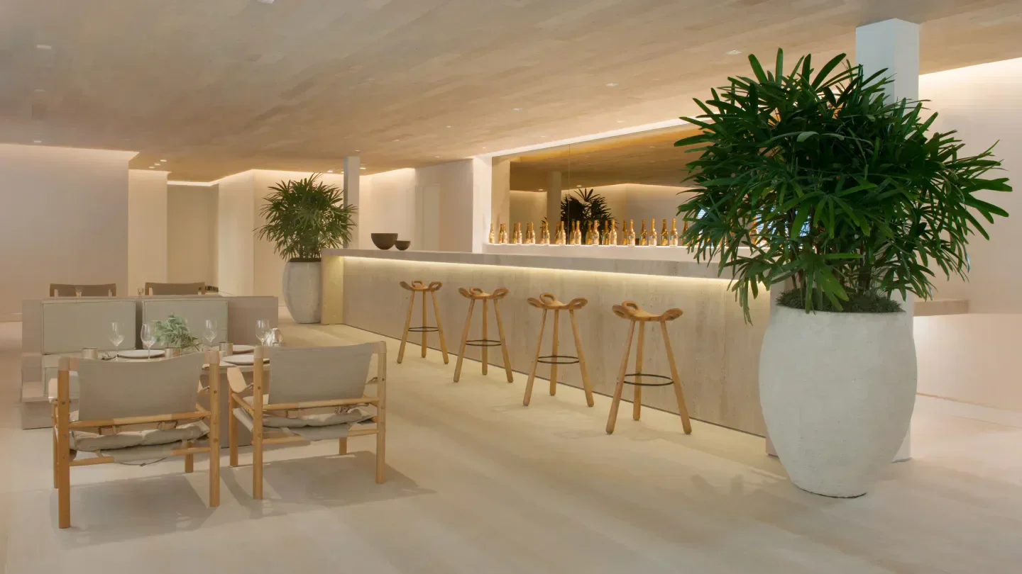 Interior of Forte dei Marmi restaurant in Miami, featuring bar and seating area.