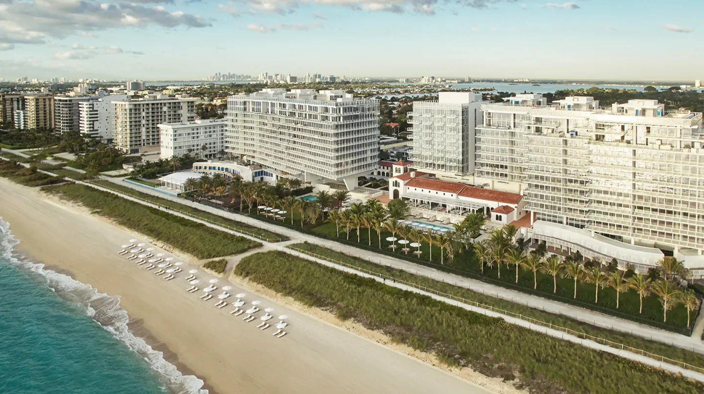 Aerial view of Four Seasons Hotel at The Surf Club in Miami, overlooking the beach.