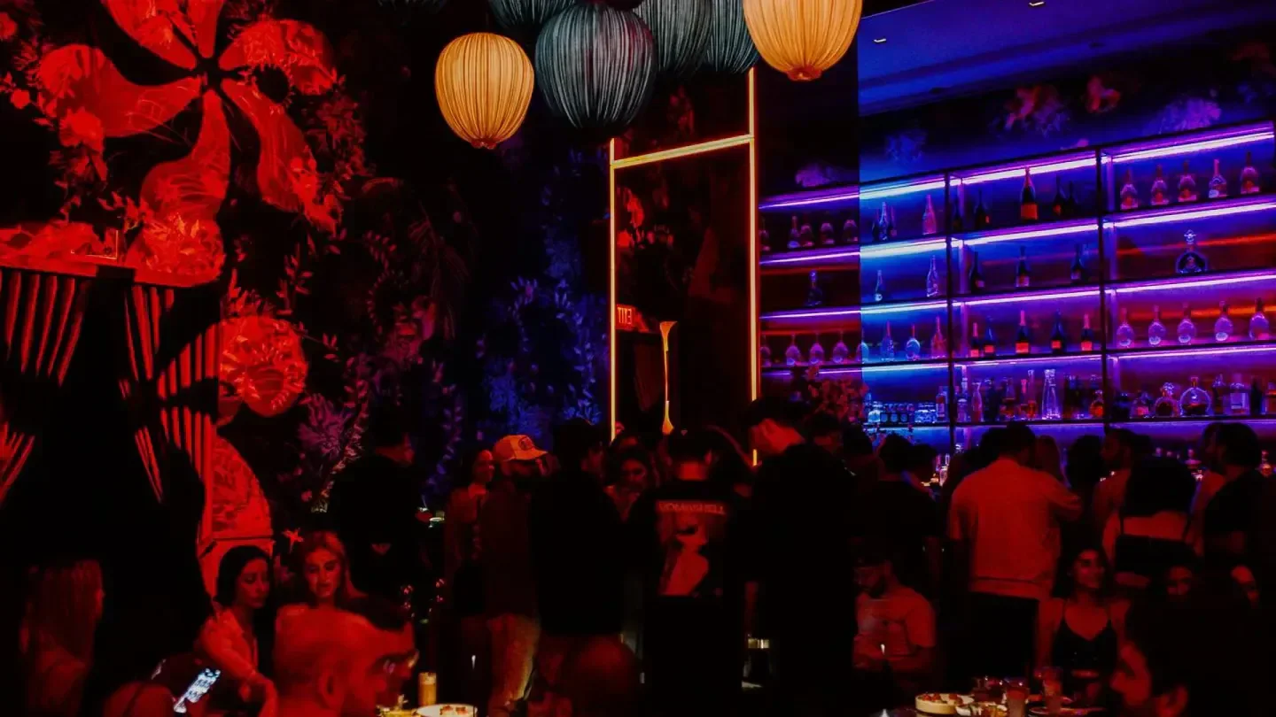 Gekko Lounge Miami nightclub interior with vibrant lighting and a busy crowd