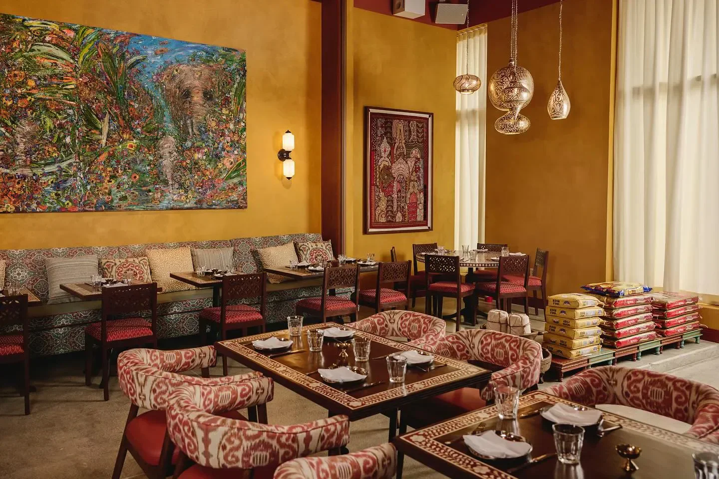 Elegant dining at Ghee Indian Kitchen in Miami, featuring artistic decor and inviting ambiance.