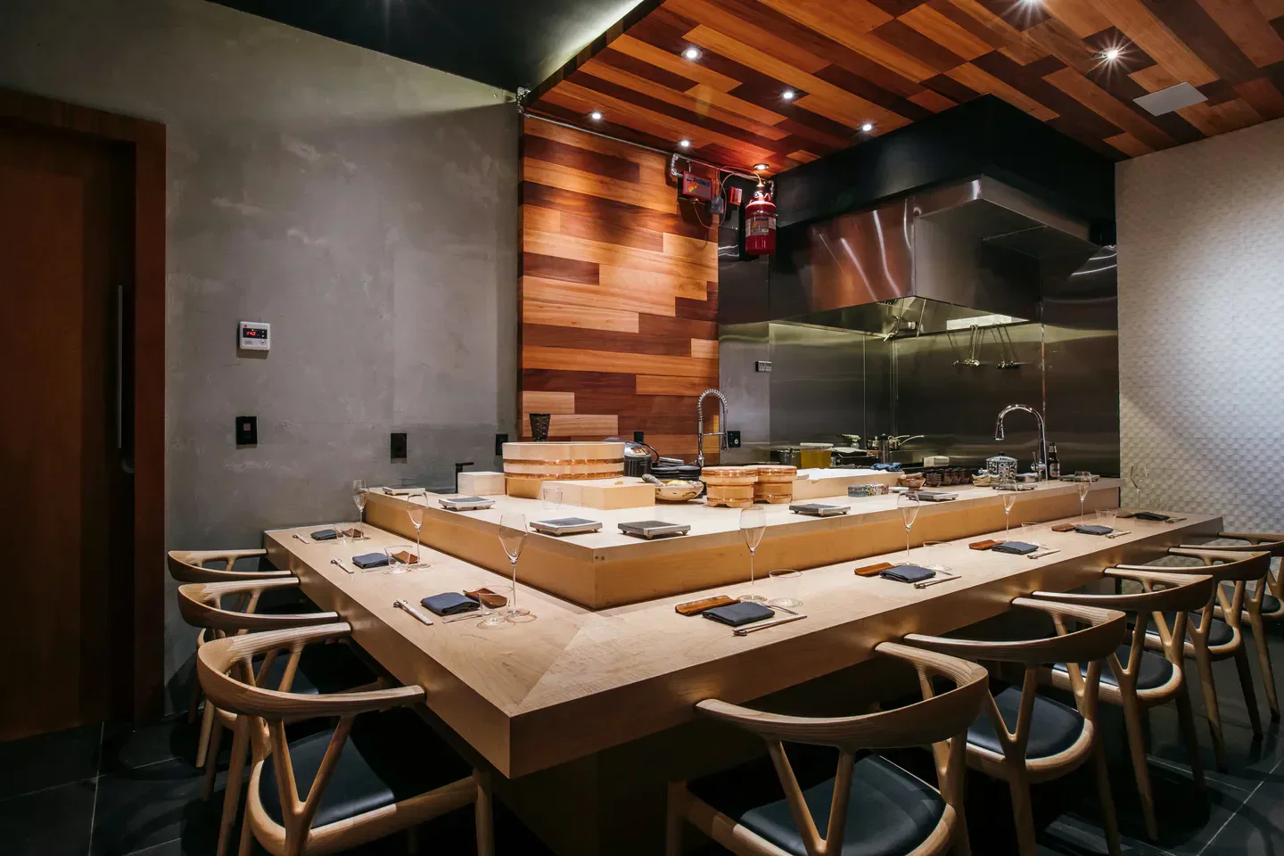 Interior view of Hiden restaurant in Miami, showcasing the sushi bar and seating area.