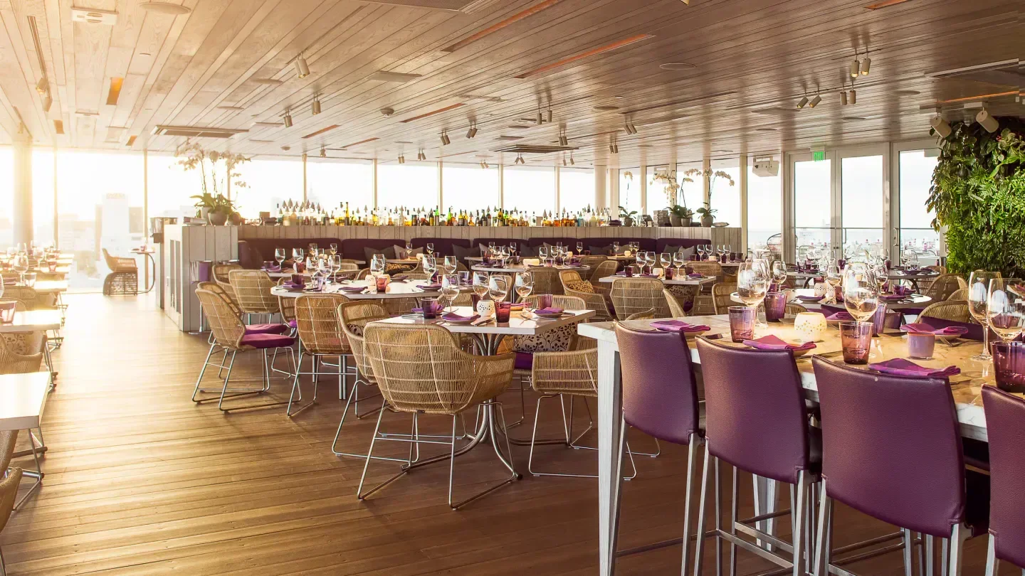 Dining area at Juvia rooftop restaurant in Miami with beautiful tables and chairs