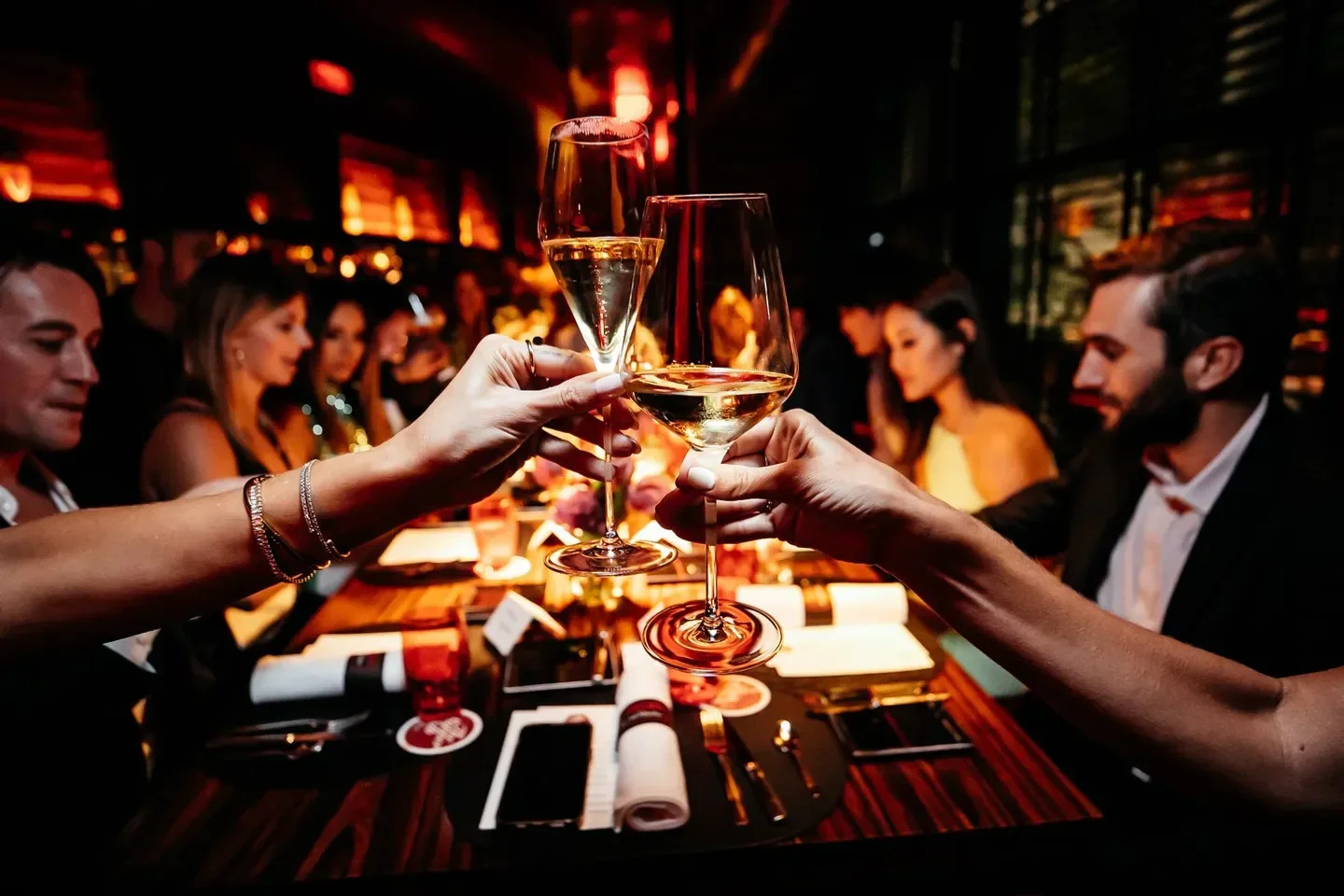 Cheers at L'Atelier de Joël Robuchon - Miami, elegant dining in Miami restaurant setting.