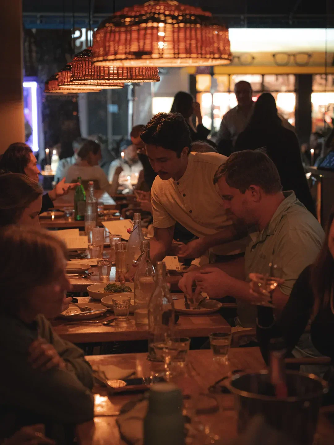 Dining experience at Los Félix in Miami. Customers enjoying the atmosphere in the restaurant.