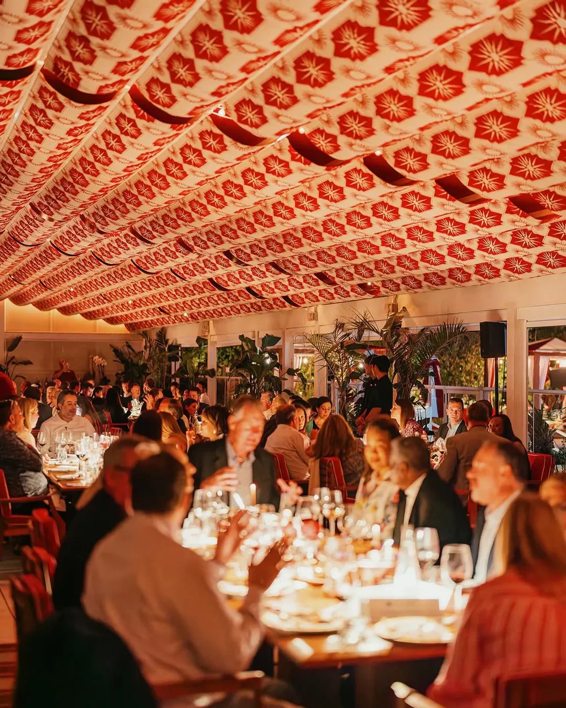 Dining room at Los Fuegos in Miami with a beautiful patterned ceiling and tables