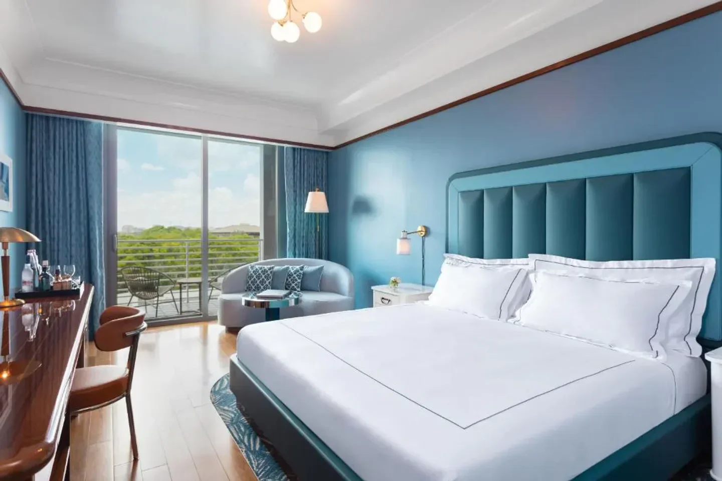 Elegant bedroom at Mr. C Miami Coconut Grove, Miami with balcony view.