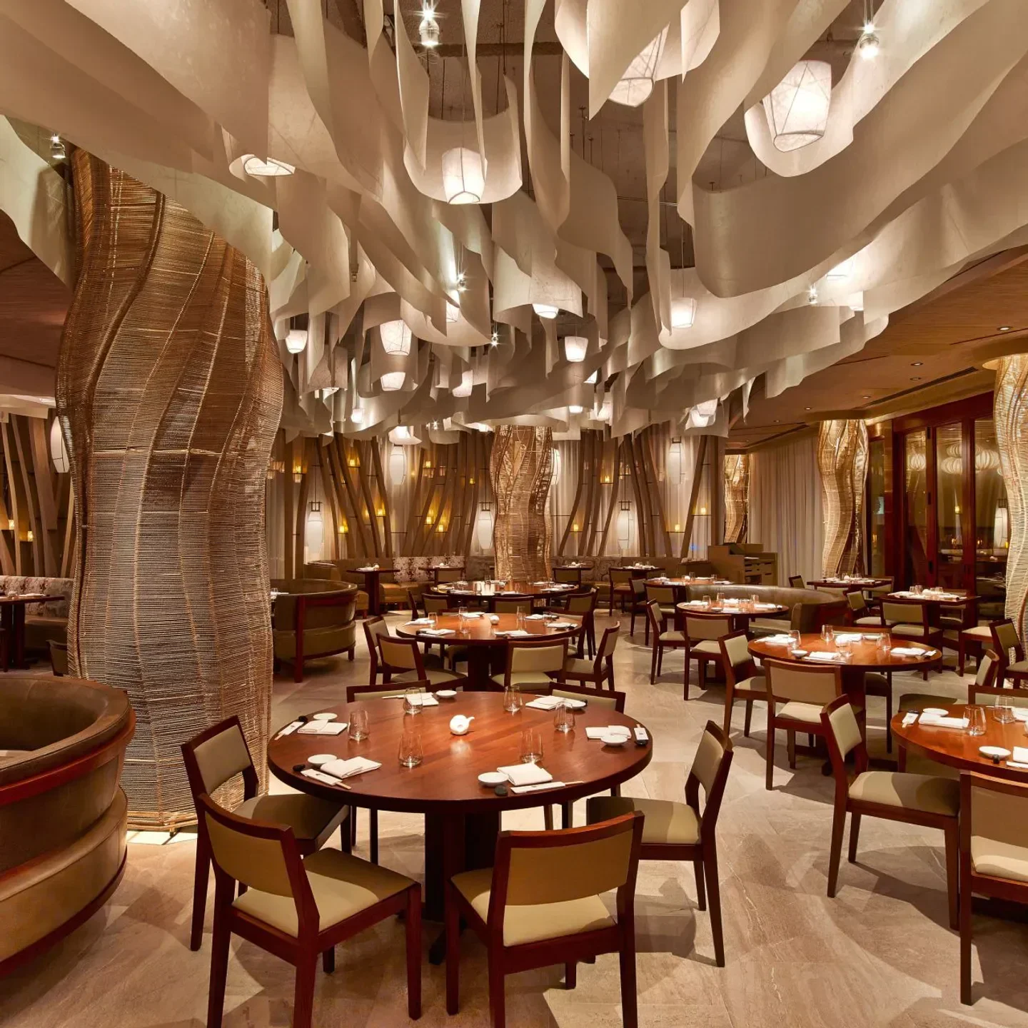 Interior of Nobu Miami restaurant showcasing unique ceiling design and elegant dining tables.