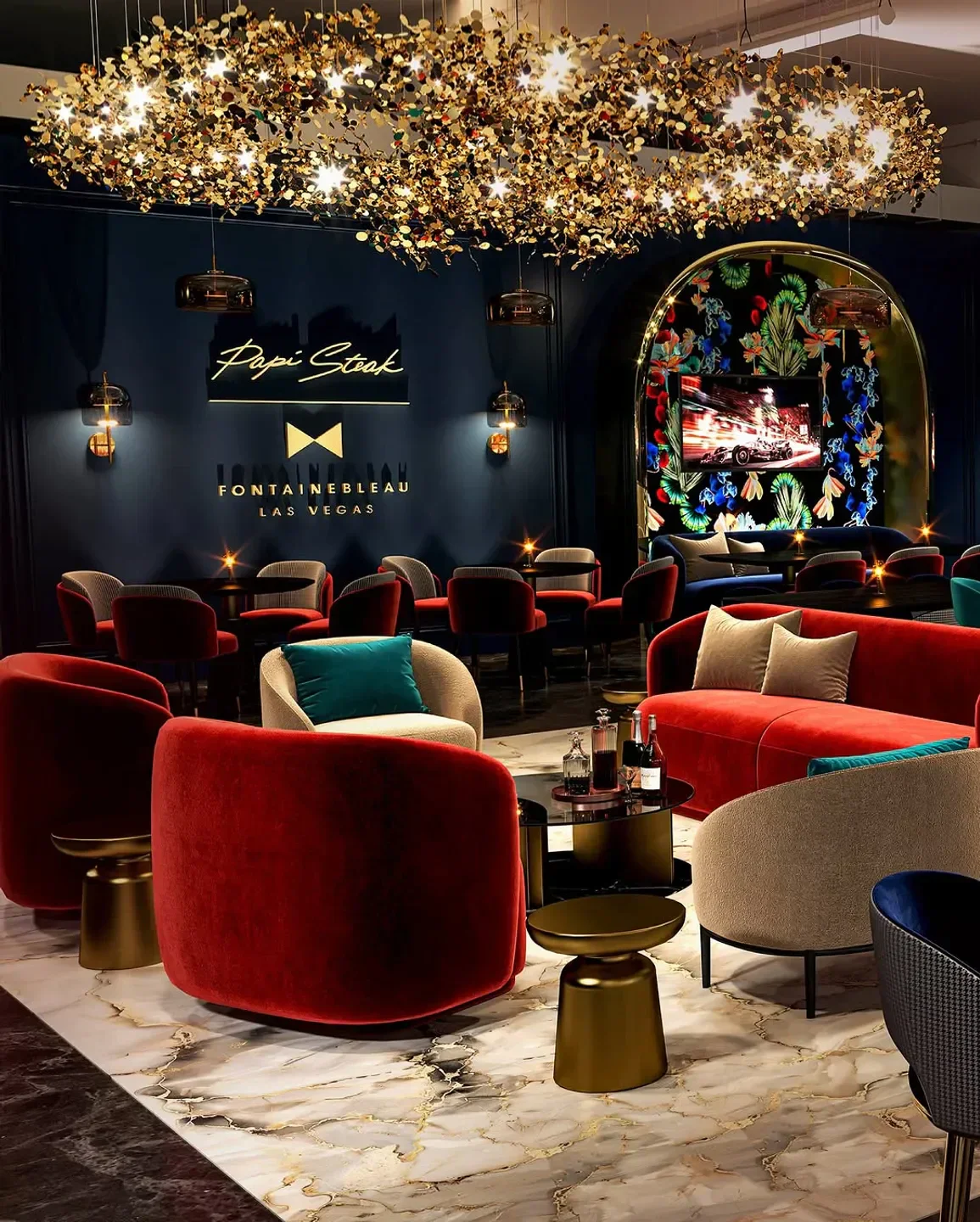 Stylish interior of Papi Steak Miami, featuring luxurious seating and a decorative light fixture.