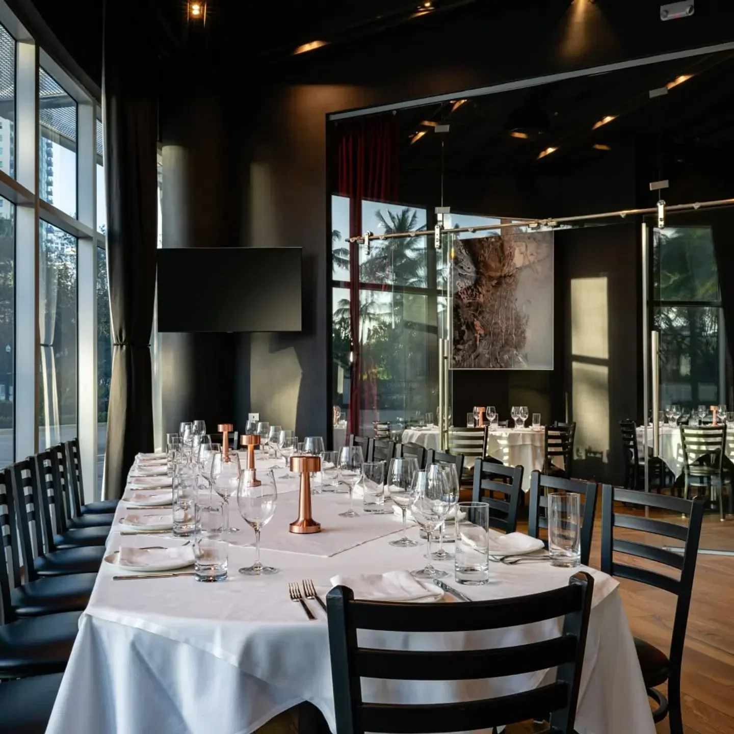 Elegant dining at RED South Beach in Miami with long table setting and fine details.