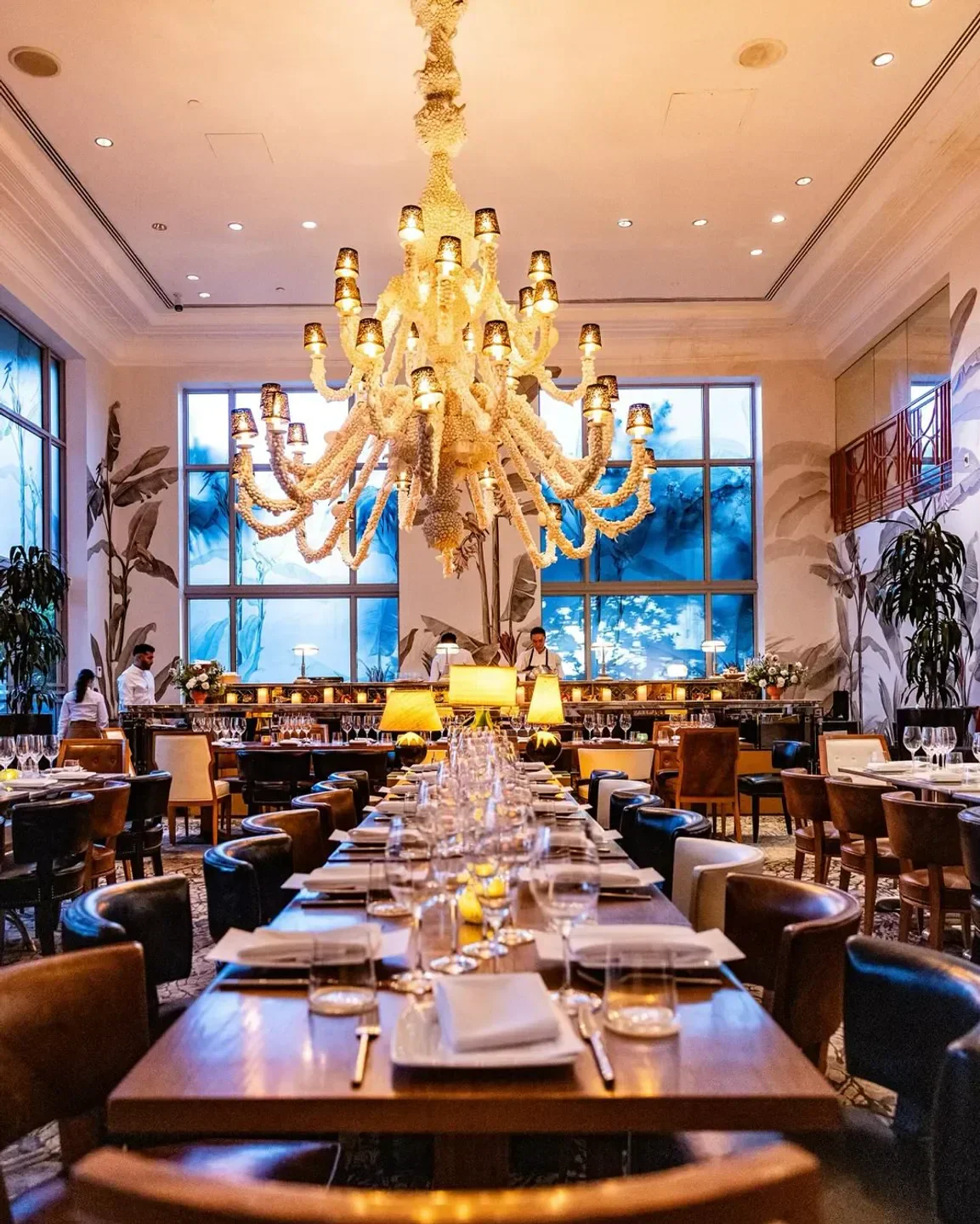 Elegant dining room at SLS South Beach in Miami, featuring a stunning chandelier.