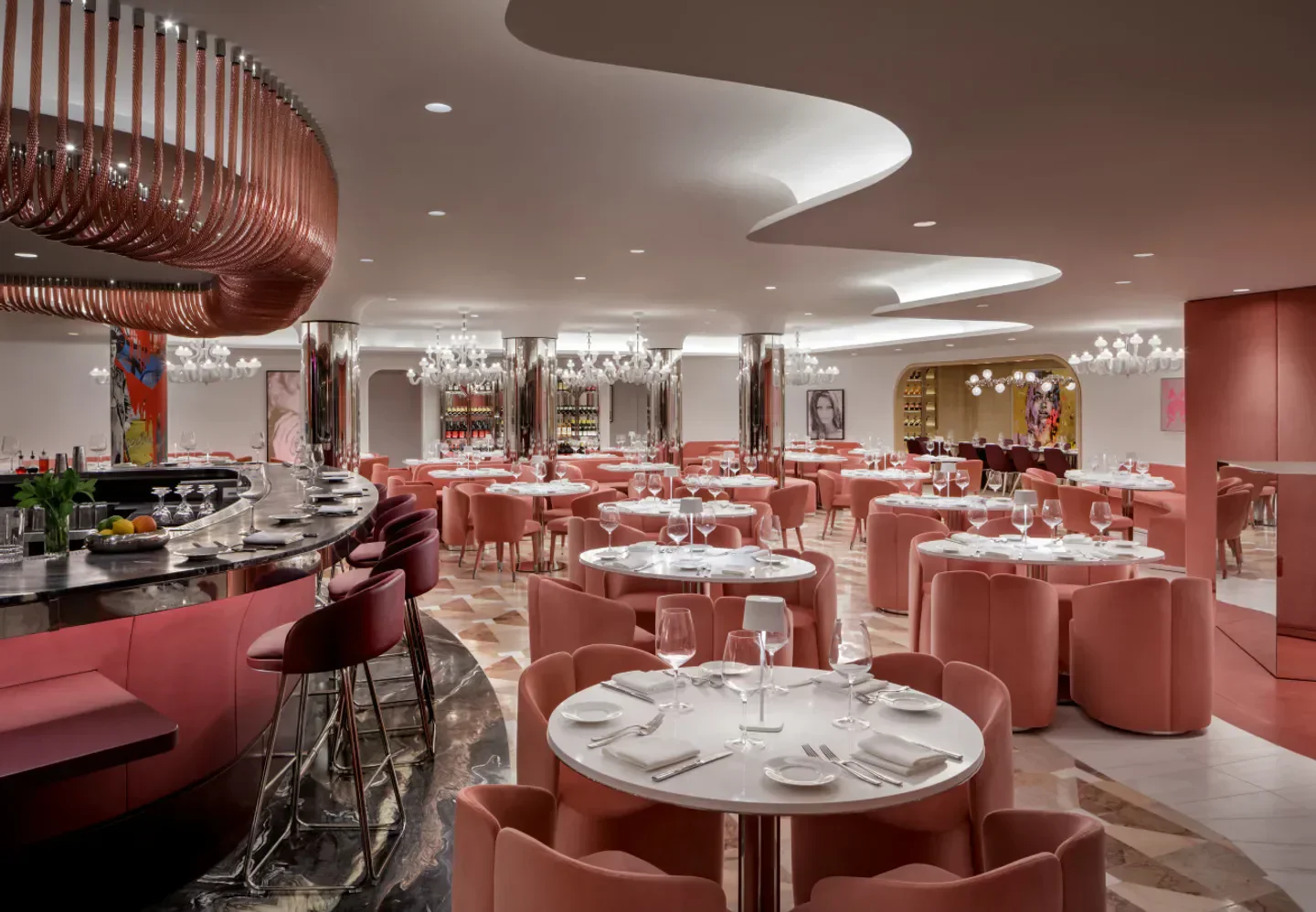 Elegant dining room at Sofia Restaurant in Miami, featuring pink decor and stylish seating.