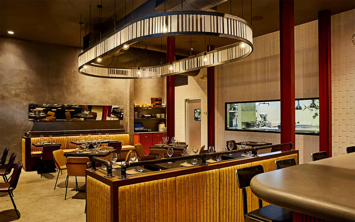 Elegant dining area at Stubborn Seed in Miami, featuring unique lighting and decor.