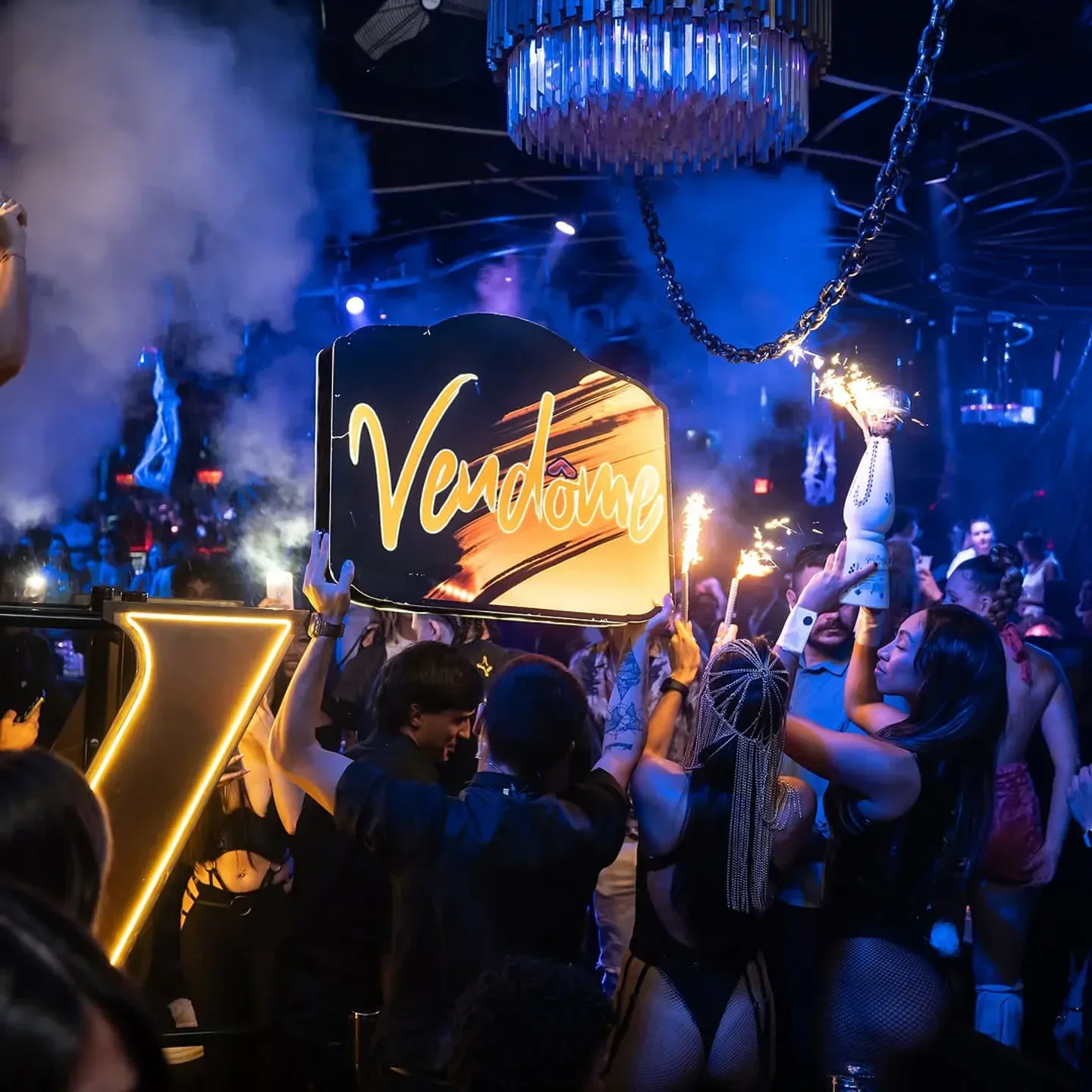 Party scene at Vendome nightclub in Miami, with sparklers and crowd