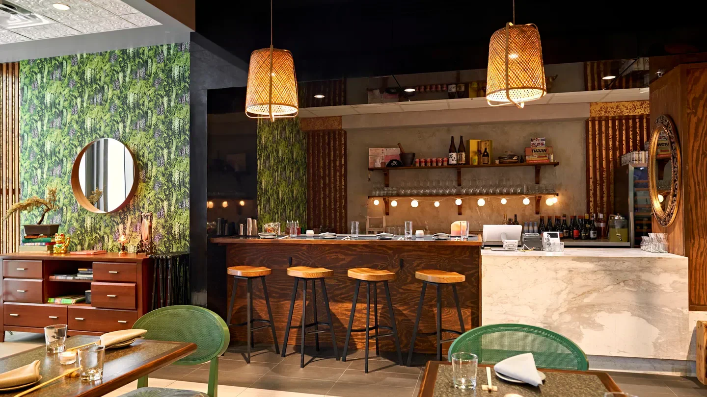 Interior of Zitz Sum restaurant in Miami, with stylish bar and unique decor.